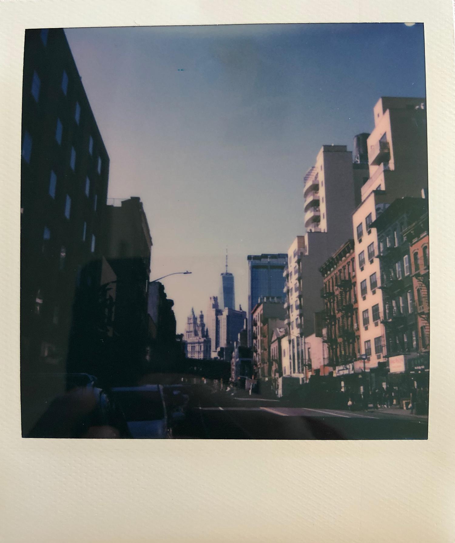 A Polaroid photo the lower Manhattan skyline looking Southeast on East Broadway in Chinatown